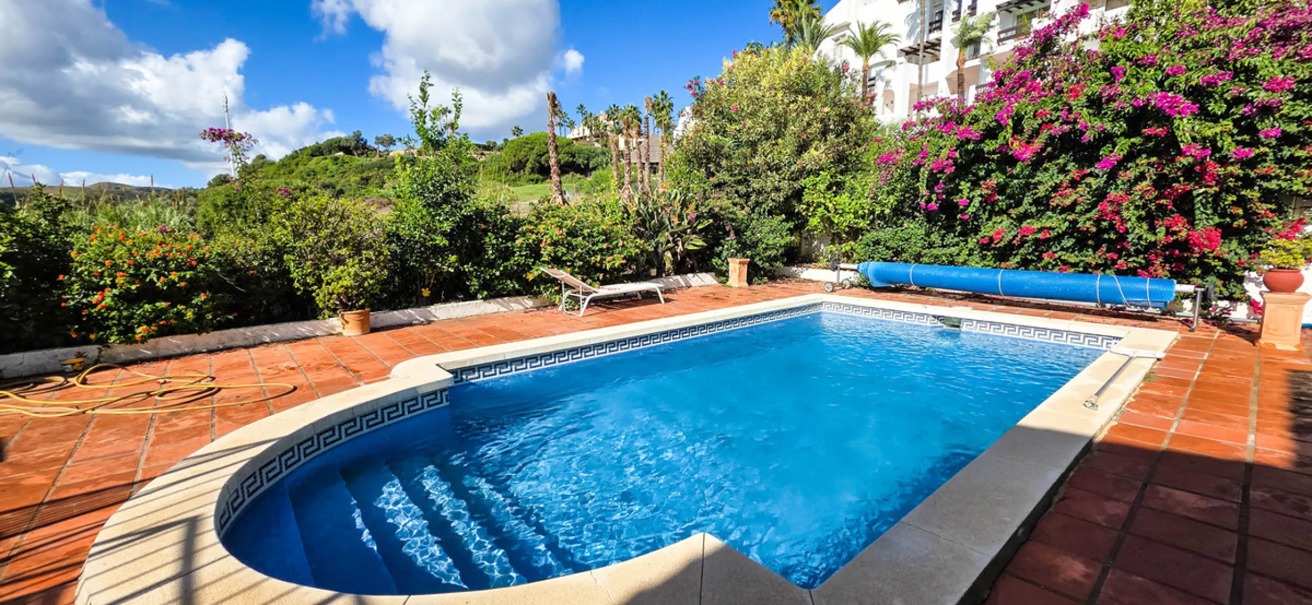 Set on the front line of La Duquesa's golf course, this south-facing semi-detached bungalow combines space, sustainability, and location in one irresistible package. Offering five bedrooms, all with ensuite bathrooms, this is a home designed for comfortab