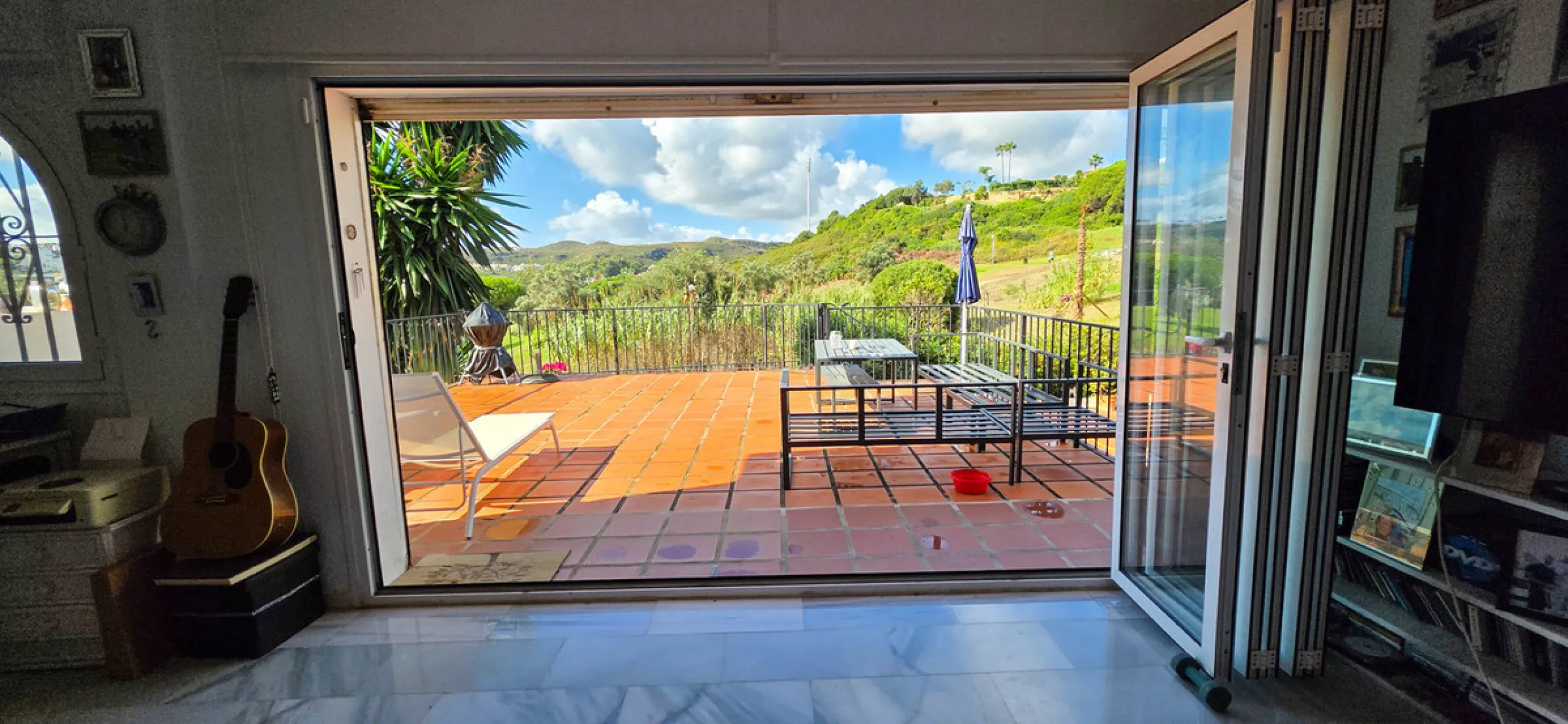 Set on the front line of La Duquesa's golf course, this south-facing semi-detached bungalow combines space, sustainability, and location in one irresistible package. Offering five bedrooms, all with ensuite bathrooms, this is a home designed for comfortab
