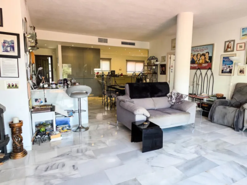 Set on the front line of La Duquesa's golf course, this south-facing semi-detached bungalow combines space, sustainability, and location in one irresistible package. Offering five bedrooms, all with ensuite bathrooms, this is a home designed for comfortab