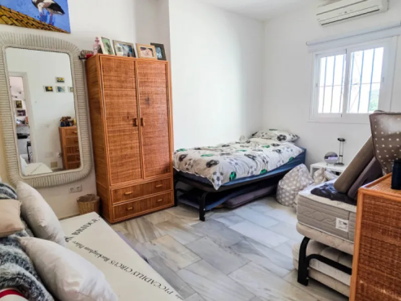 Set on the front line of La Duquesa's golf course, this south-facing semi-detached bungalow combines space, sustainability, and location in one irresistible package. Offering five bedrooms, all with ensuite bathrooms, this is a home designed for comfortab