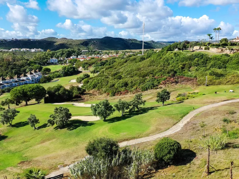 Set on the front line of La Duquesa's golf course, this south-facing semi-detached bungalow combines space, sustainability, and location in one irresistible package. Offering five bedrooms, all with ensuite bathrooms, this is a home designed for comfortab
