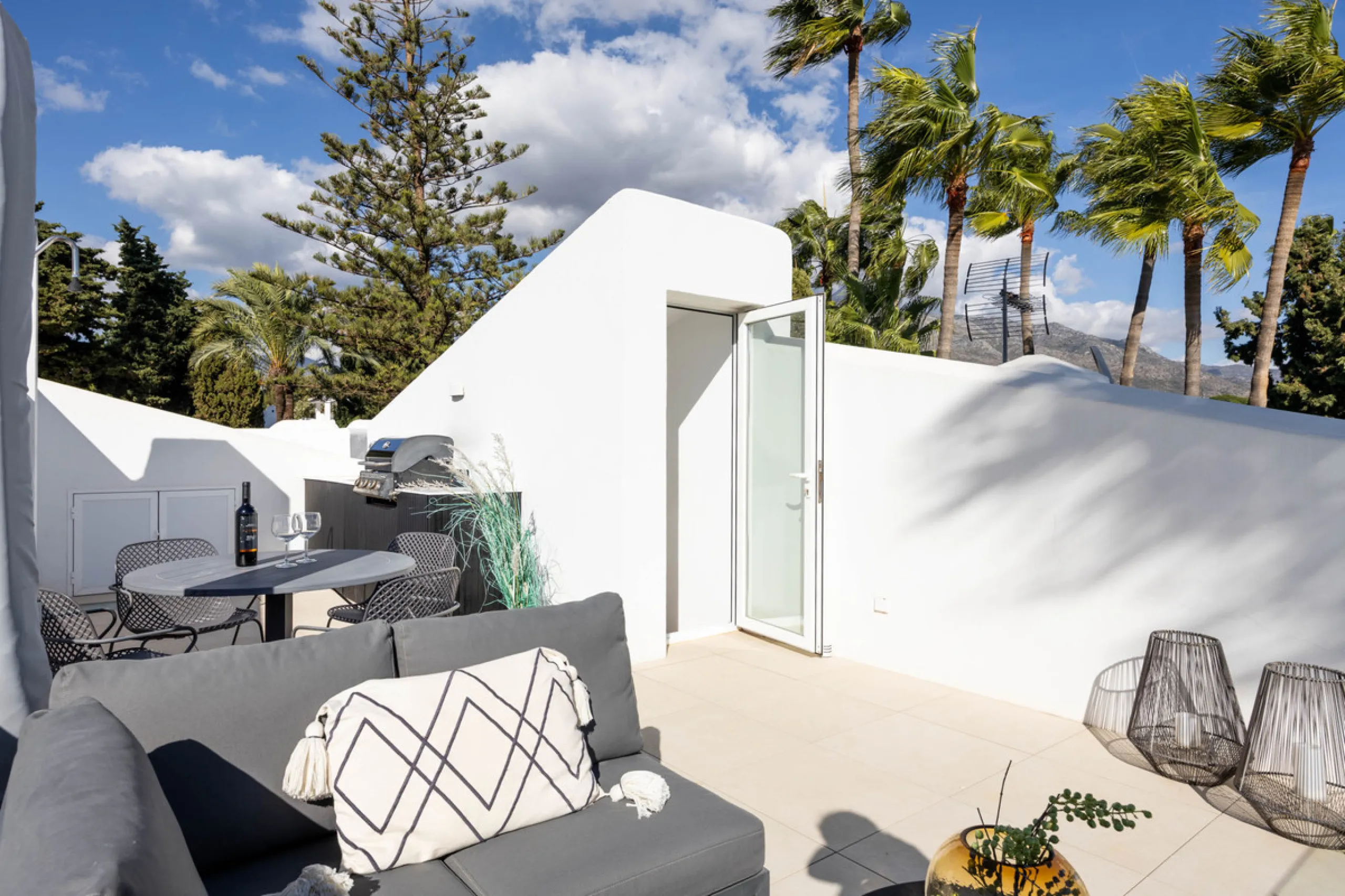 Welcome to this elegant 2-bedroom apartment, ideally positioned on the top floor in the heart of Nueva Andalucía—overlooking the renowned Aloha Golf Course and offering spectacular sea, mountain, and golf views. This thoughtfully renovated home combines m