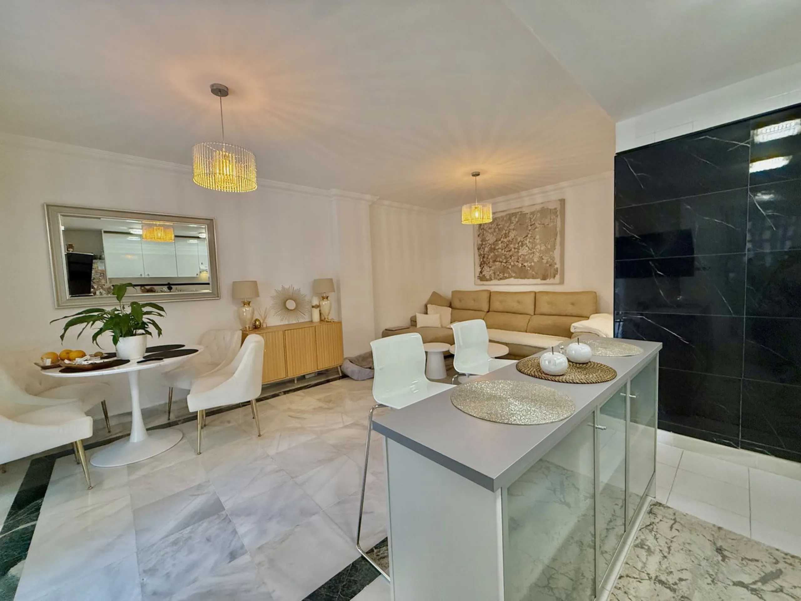 Located in a prestigious urbanization in Nagüeles, within the exclusive neighborhood of La Carolina, Guadalpin, Marbella, this property offers a unique lifestyle. The layout includes an entrance hall that leads to two bedrooms, two bathrooms, a spacious l