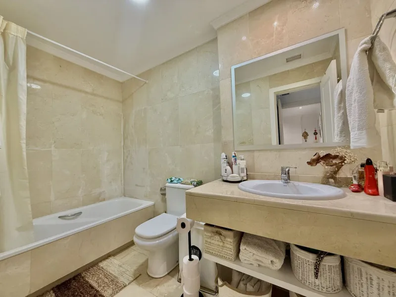 Located in a prestigious urbanization in Nagüeles, within the exclusive neighborhood of La Carolina, Guadalpin, Marbella, this property offers a unique lifestyle. The layout includes an entrance hall that leads to two bedrooms, two bathrooms, a spacious l