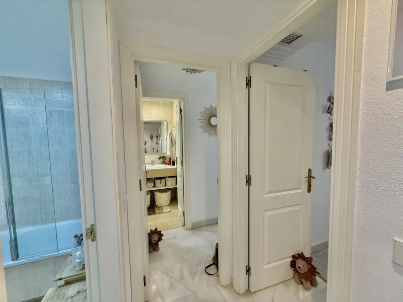 Located in a prestigious urbanization in Nagüeles, within the exclusive neighborhood of La Carolina, Guadalpin, Marbella, this property offers a unique lifestyle. The layout includes an entrance hall that leads to two bedrooms, two bathrooms, a spacious l