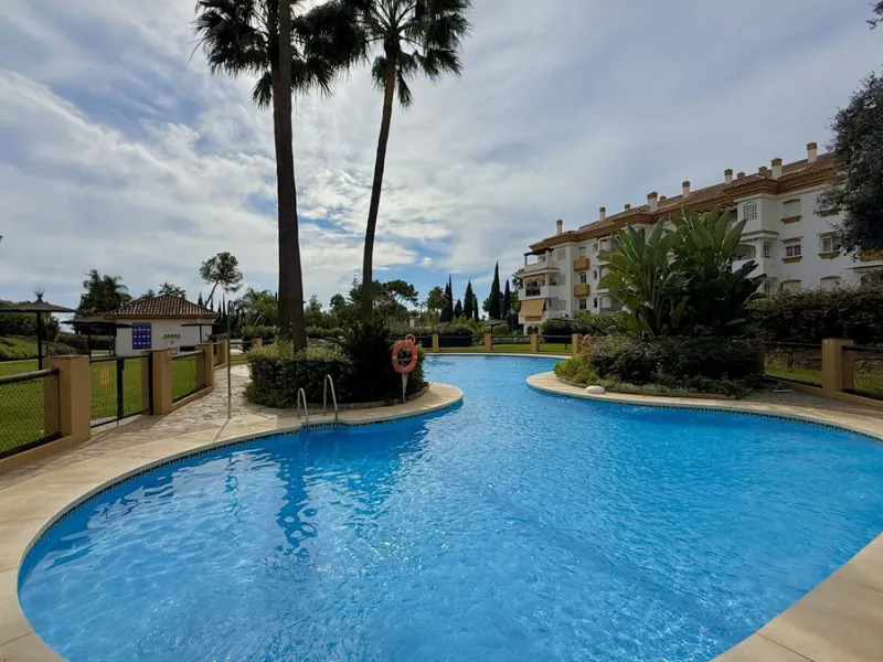 Located in a prestigious urbanization in Nagüeles, within the exclusive neighborhood of La Carolina, Guadalpin, Marbella, this property offers a unique lifestyle. The layout includes an entrance hall that leads to two bedrooms, two bathrooms, a spacious l