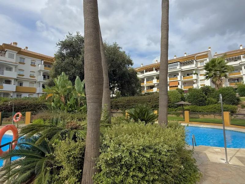 Located in a prestigious urbanization in Nagüeles, within the exclusive neighborhood of La Carolina, Guadalpin, Marbella, this property offers a unique lifestyle. The layout includes an entrance hall that leads to two bedrooms, two bathrooms, a spacious l