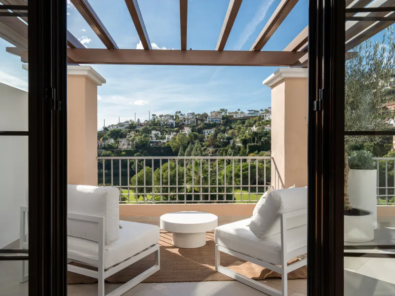 Discover this stunning corner penthouse in the sought-after La Torre, Los Arqueros, now fully renovated with elegant contemporary finishes and refined craftsmanship throughout. The open-plan kitchen seamlessly connects with the spacious living area, creat