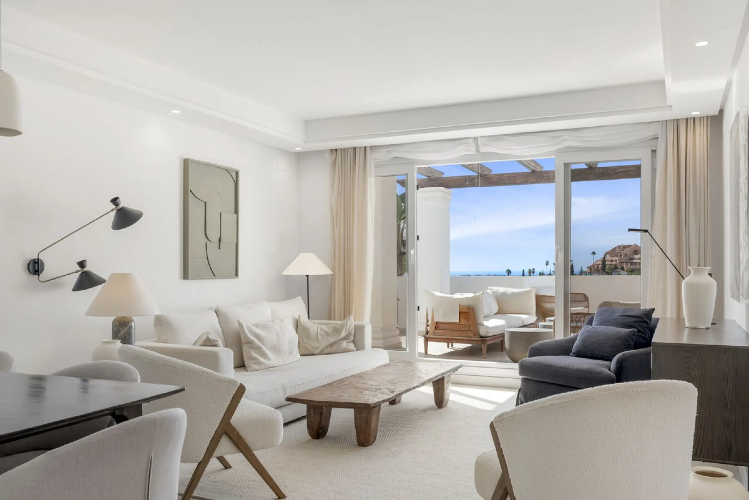 We are delighted to present this stunning first-floor apartment in Aloha, Nueva Andalucía, offering breathtaking panoramic views of the coastline. Formerly the show home of the development, this exceptional property is sold fully furnished and finished to