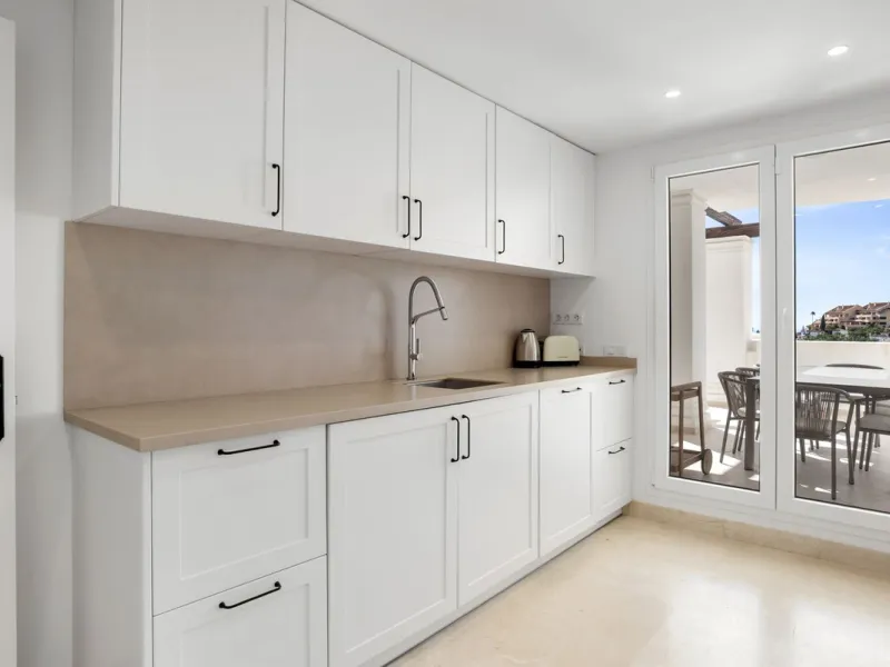 We are delighted to present this stunning first-floor apartment in Aloha, Nueva Andalucía, offering breathtaking panoramic views of the coastline. Formerly the show home of the development, this exceptional property is sold fully furnished and finished to
