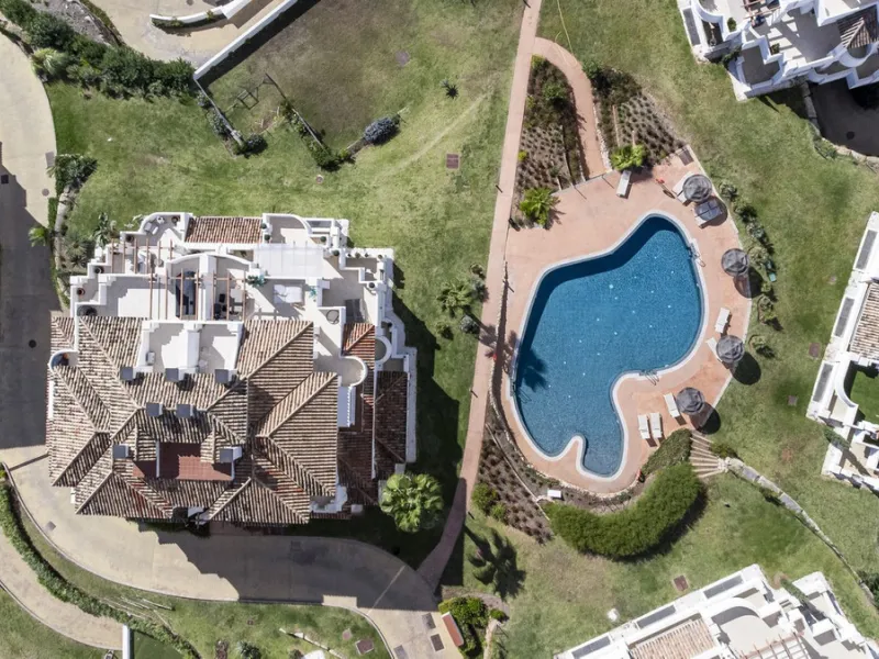 We are delighted to present this stunning first-floor apartment in Aloha, Nueva Andalucía, offering breathtaking panoramic views of the coastline. Formerly the show home of the development, this exceptional property is sold fully furnished and finished to