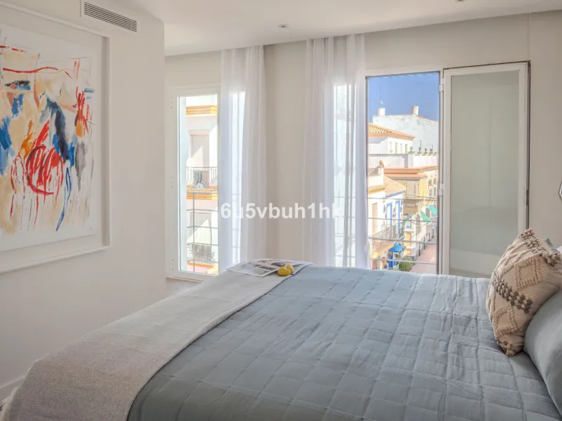 There is something very easy about this apartment. It sits on a bright corner in Estepona's historic centre, next to a plaza, with the life of the town just outside and the beach only a short walk away.