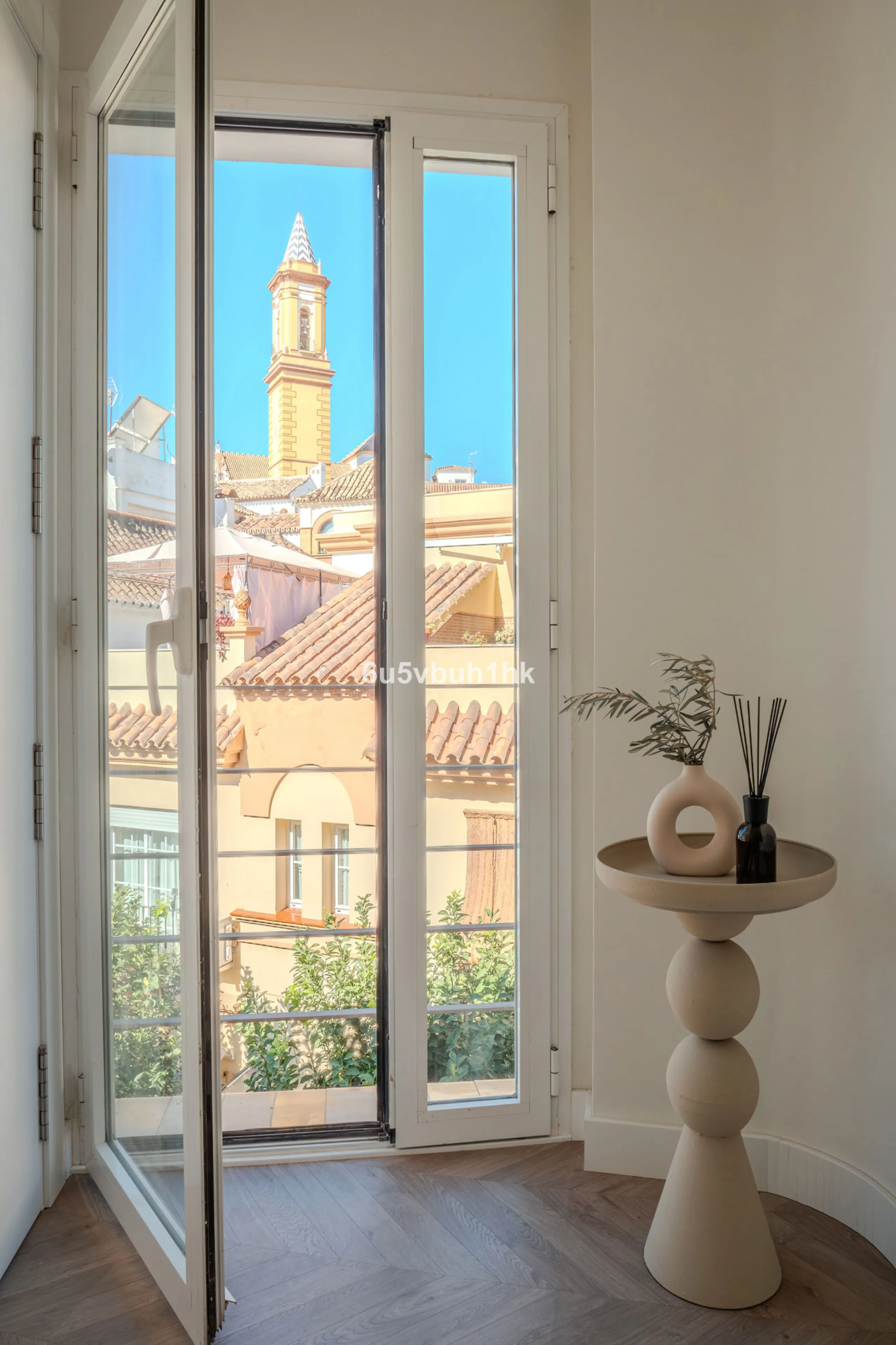 There is something very easy about this apartment. It sits on a bright corner in Estepona's historic centre, next to a plaza, with the life of the town just outside and the beach only a short walk away.