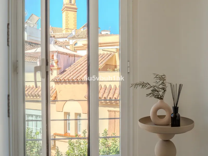 There is something very easy about this apartment. It sits on a bright corner in Estepona's historic centre, next to a plaza, with the life of the town just outside and the beach only a short walk away.