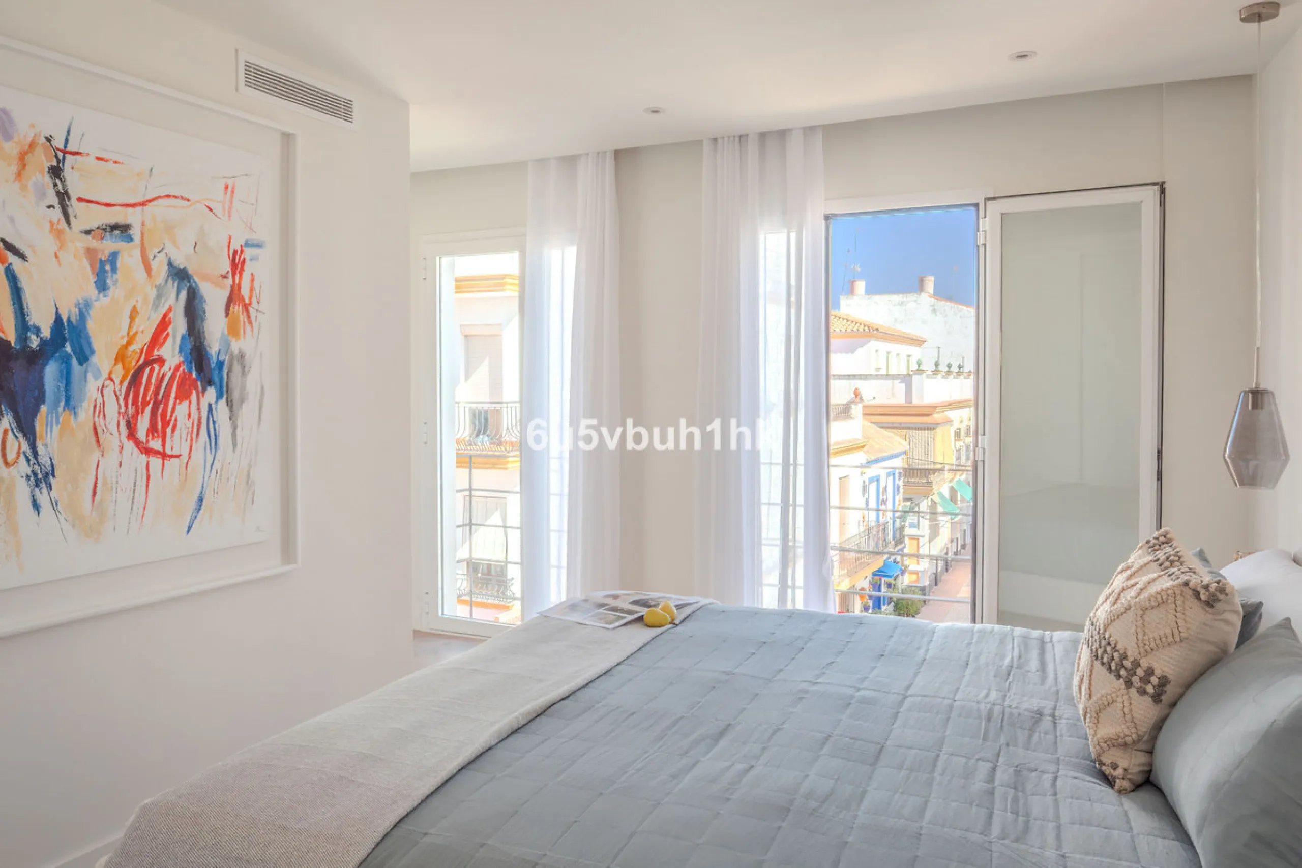 There is something very easy about this apartment. It sits on a bright corner in Estepona's historic centre, next to a plaza, with the life of the town just outside and the beach only a short walk away.