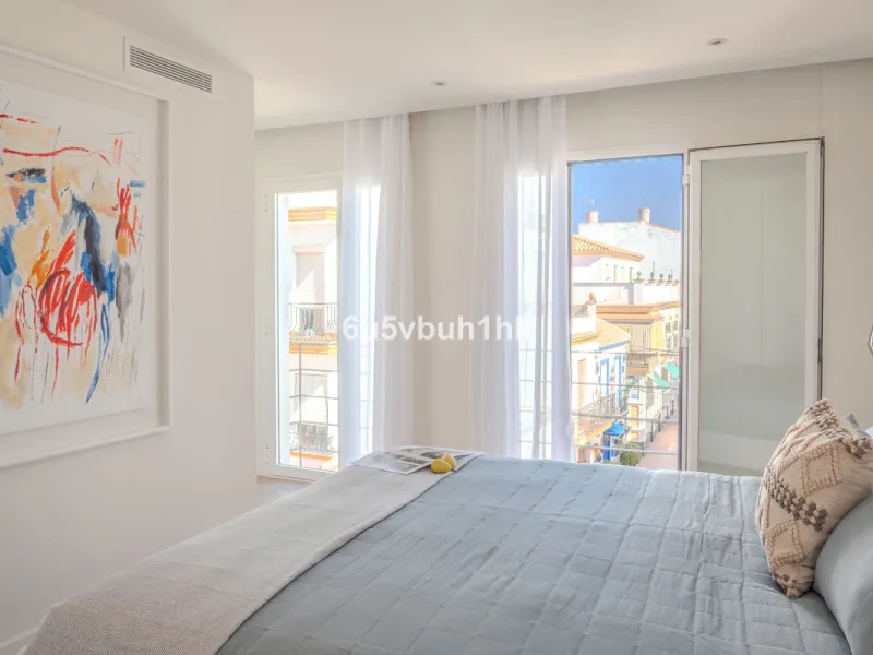 There is something very easy about this apartment. It sits on a bright corner in Estepona's historic centre, next to a plaza, with the life of the town just outside and the beach only a short walk away.