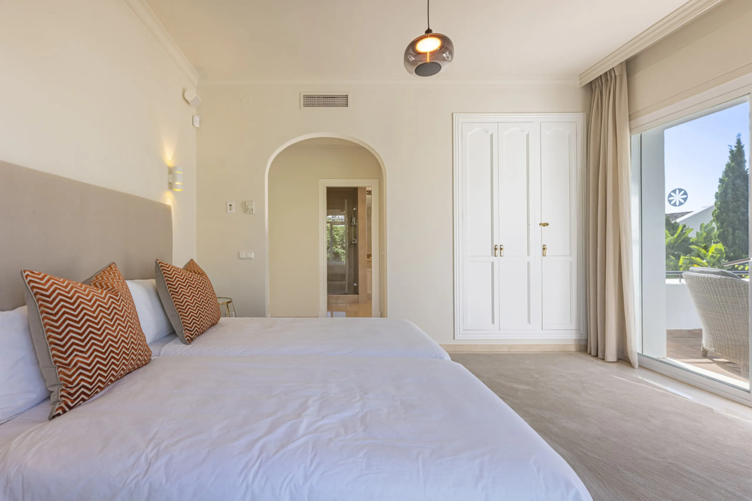Set in the prestigious gated community of La Reserva de La Quinta in Benahavís, this Andalusian-inspired villa combines timeless architecture with a privileged frontline golf position. Surrounded by lush greenery, the property offers complete privacy, ele