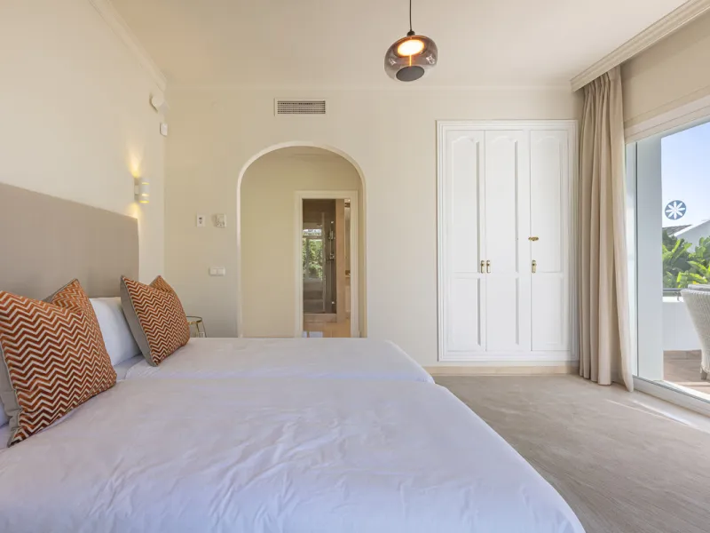 Set in the prestigious gated community of La Reserva de La Quinta in Benahavís, this Andalusian-inspired villa combines timeless architecture with a privileged frontline golf position. Surrounded by lush greenery, the property offers complete privacy, ele