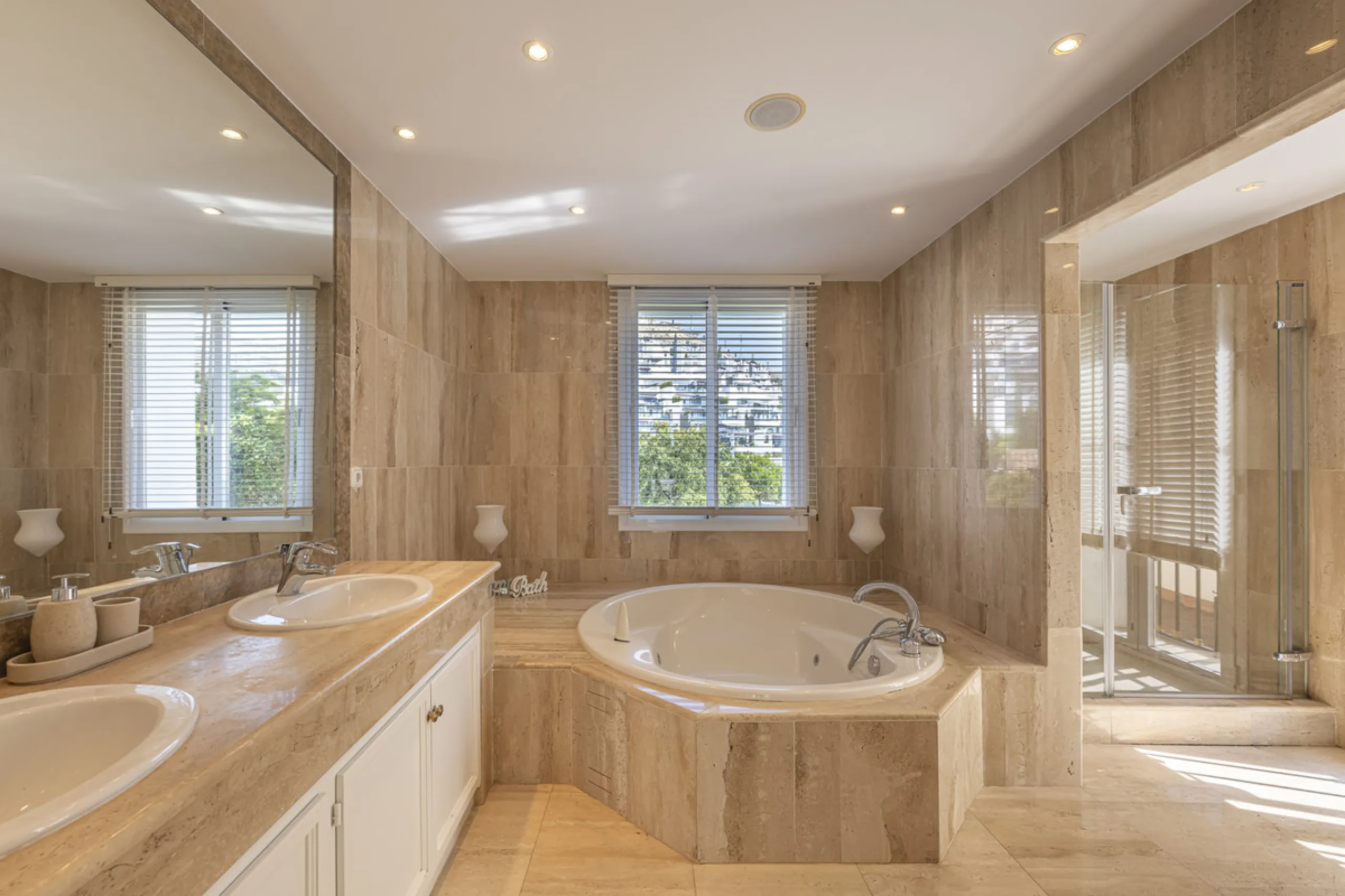 Set in the prestigious gated community of La Reserva de La Quinta in Benahavís, this Andalusian-inspired villa combines timeless architecture with a privileged frontline golf position. Surrounded by lush greenery, the property offers complete privacy, ele