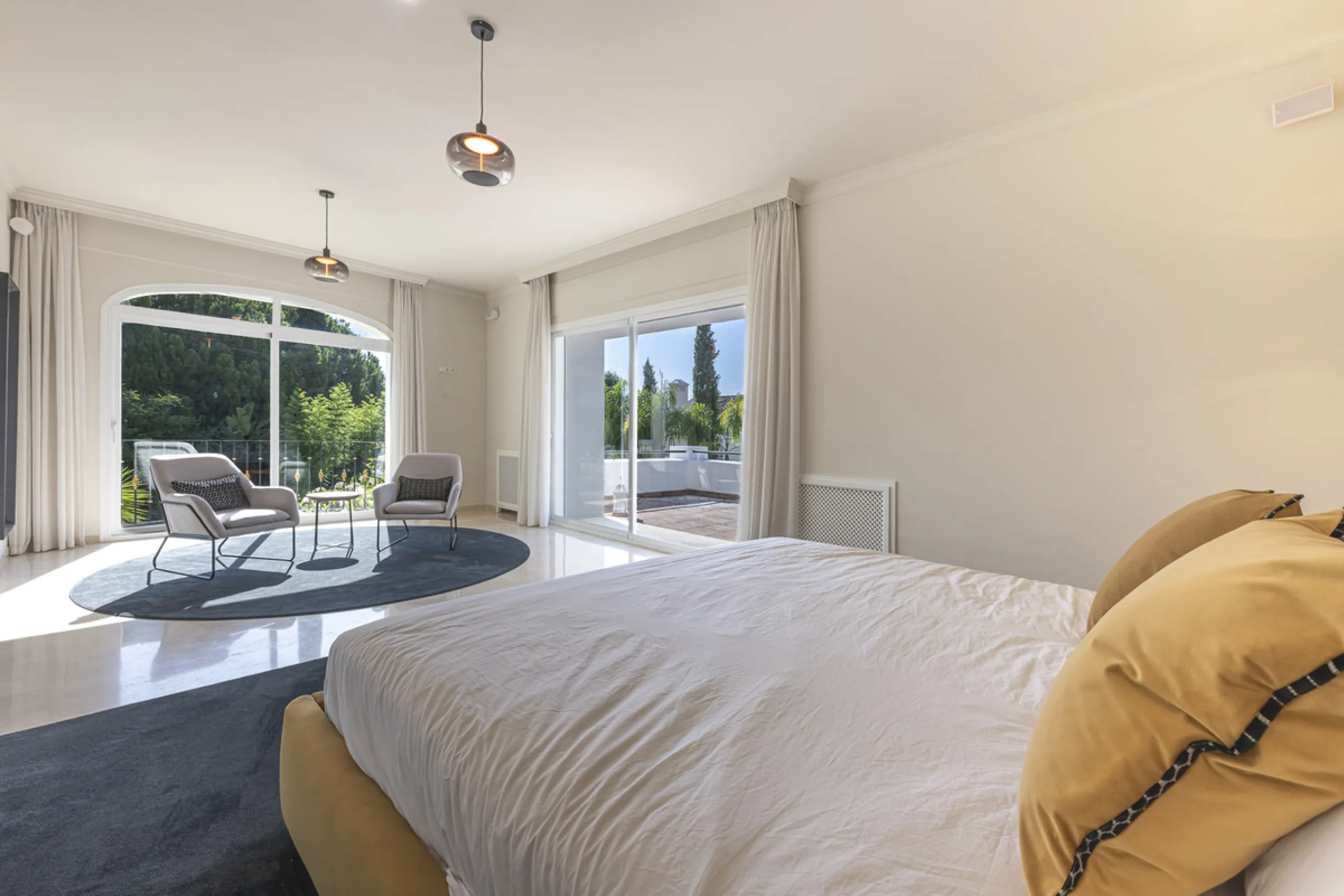 Set in the prestigious gated community of La Reserva de La Quinta in Benahavís, this Andalusian-inspired villa combines timeless architecture with a privileged frontline golf position. Surrounded by lush greenery, the property offers complete privacy, ele