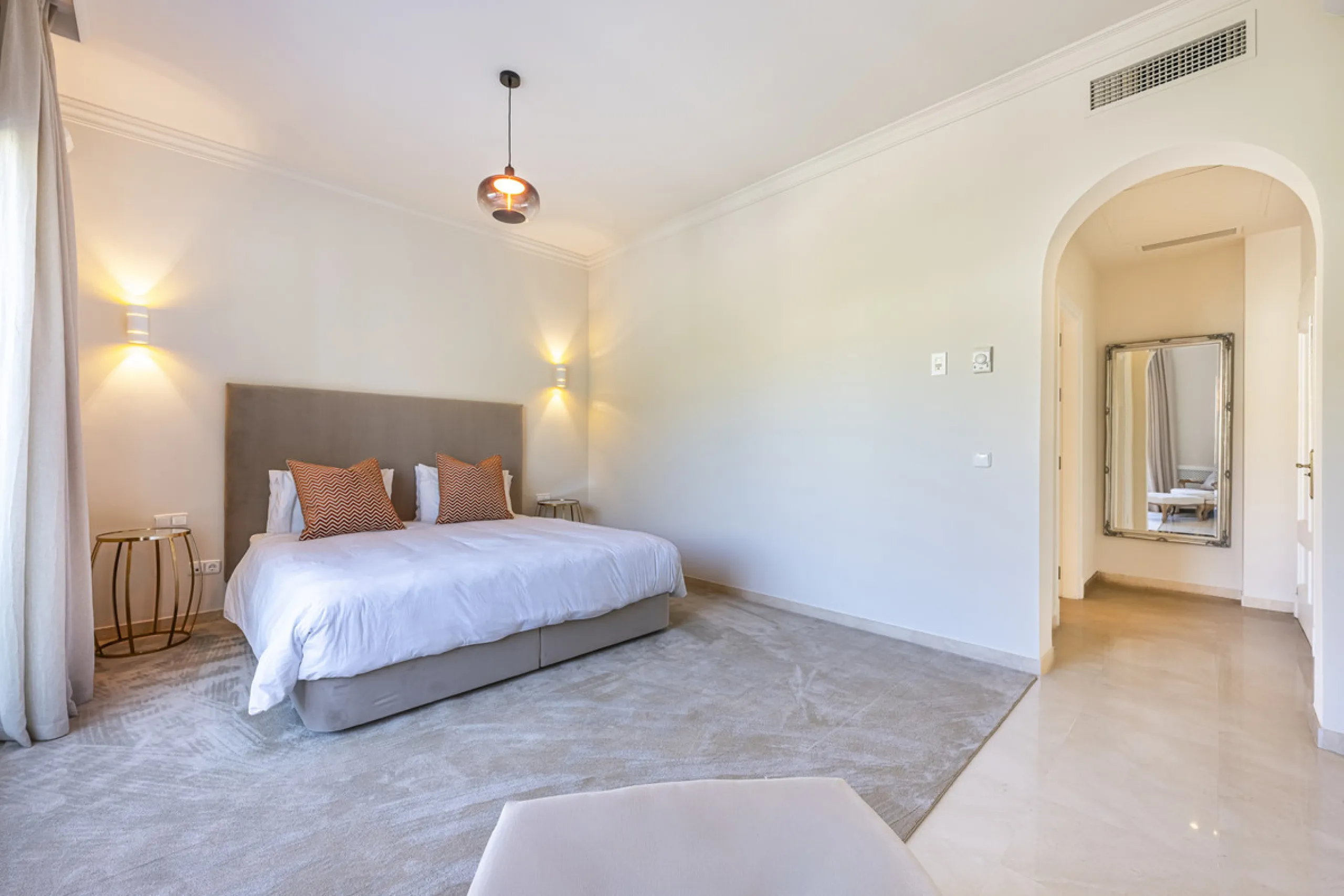 Set in the prestigious gated community of La Reserva de La Quinta in Benahavís, this Andalusian-inspired villa combines timeless architecture with a privileged frontline golf position. Surrounded by lush greenery, the property offers complete privacy, ele