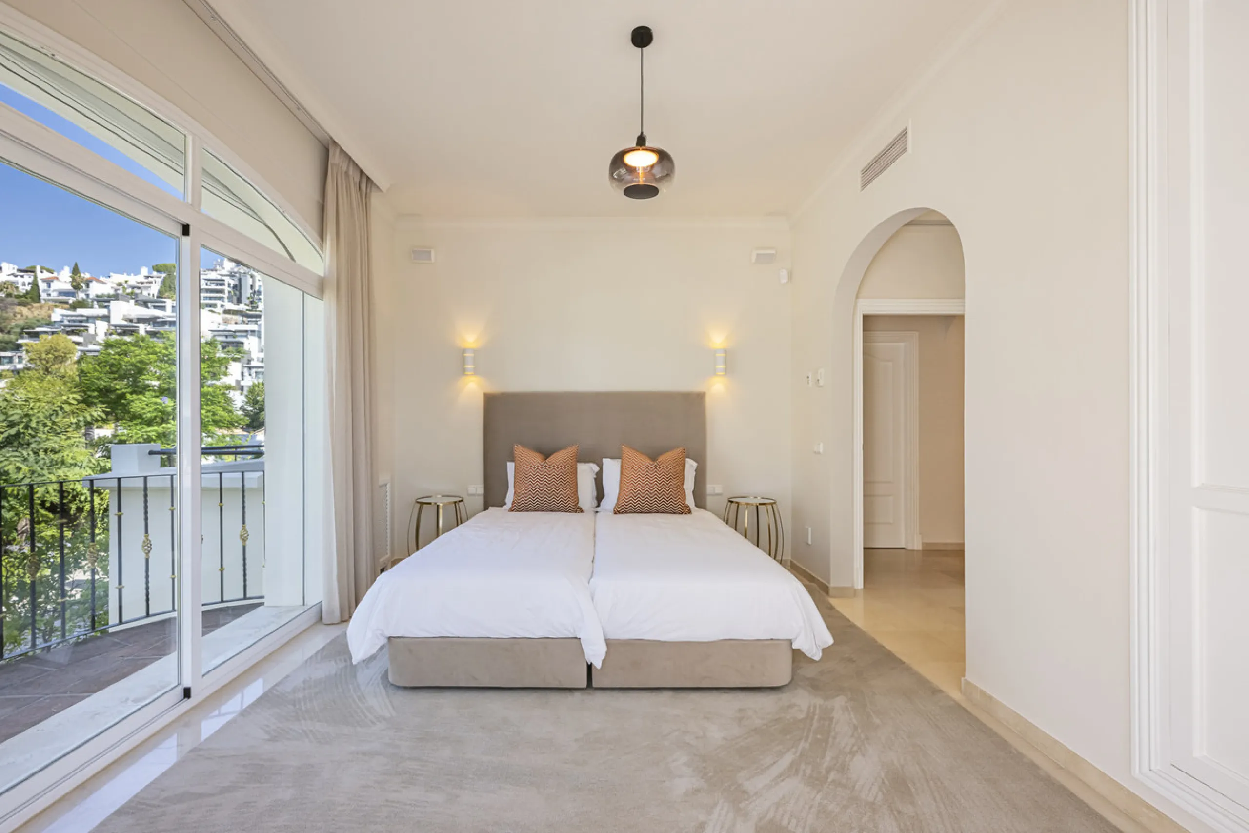 Set in the prestigious gated community of La Reserva de La Quinta in Benahavís, this Andalusian-inspired villa combines timeless architecture with a privileged frontline golf position. Surrounded by lush greenery, the property offers complete privacy, ele