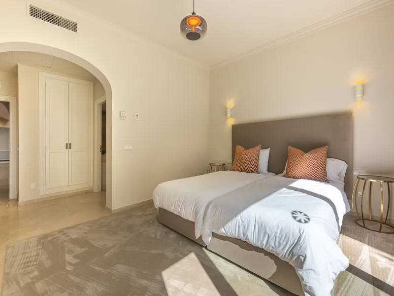Set in the prestigious gated community of La Reserva de La Quinta in Benahavís, this Andalusian-inspired villa combines timeless architecture with a privileged frontline golf position. Surrounded by lush greenery, the property offers complete privacy, ele