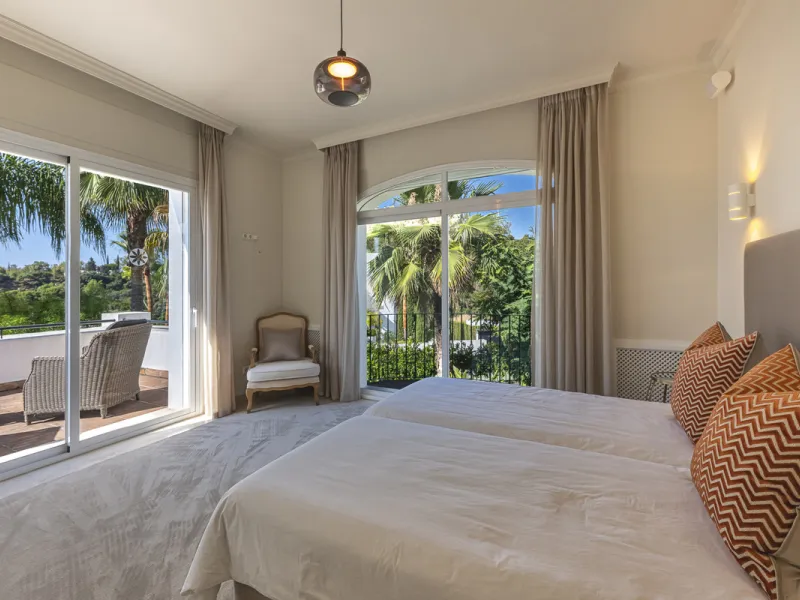 Set in the prestigious gated community of La Reserva de La Quinta in Benahavís, this Andalusian-inspired villa combines timeless architecture with a privileged frontline golf position. Surrounded by lush greenery, the property offers complete privacy, ele