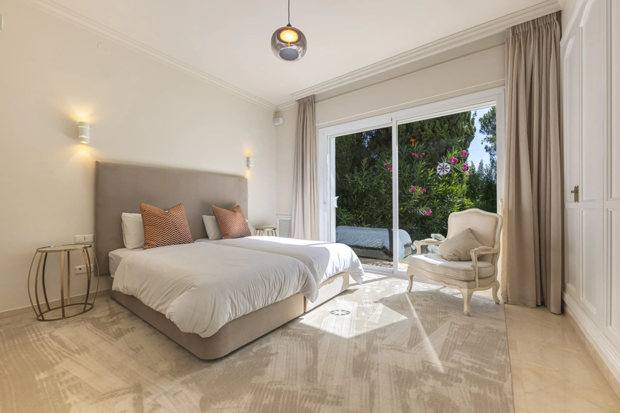 Set in the prestigious gated community of La Reserva de La Quinta in Benahavís, this Andalusian-inspired villa combines timeless architecture with a privileged frontline golf position. Surrounded by lush greenery, the property offers complete privacy, ele