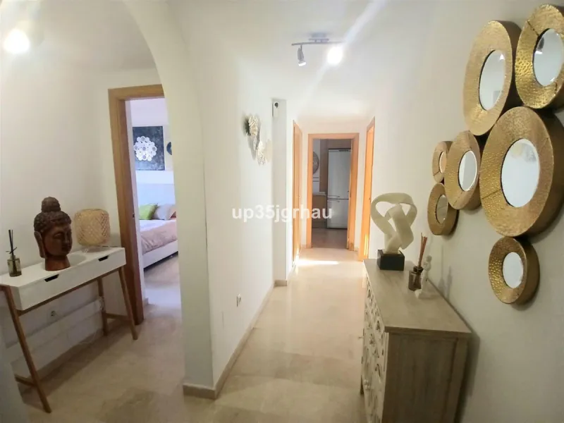 Next to one of the most sought-after areas between Estepona & Marbella, I present to you an exclusive, beautiful apartment for sale or long-term rental, with 2 spacious bedrooms and two bathrooms, one of them en-suite, and a fully furnished and equipped k