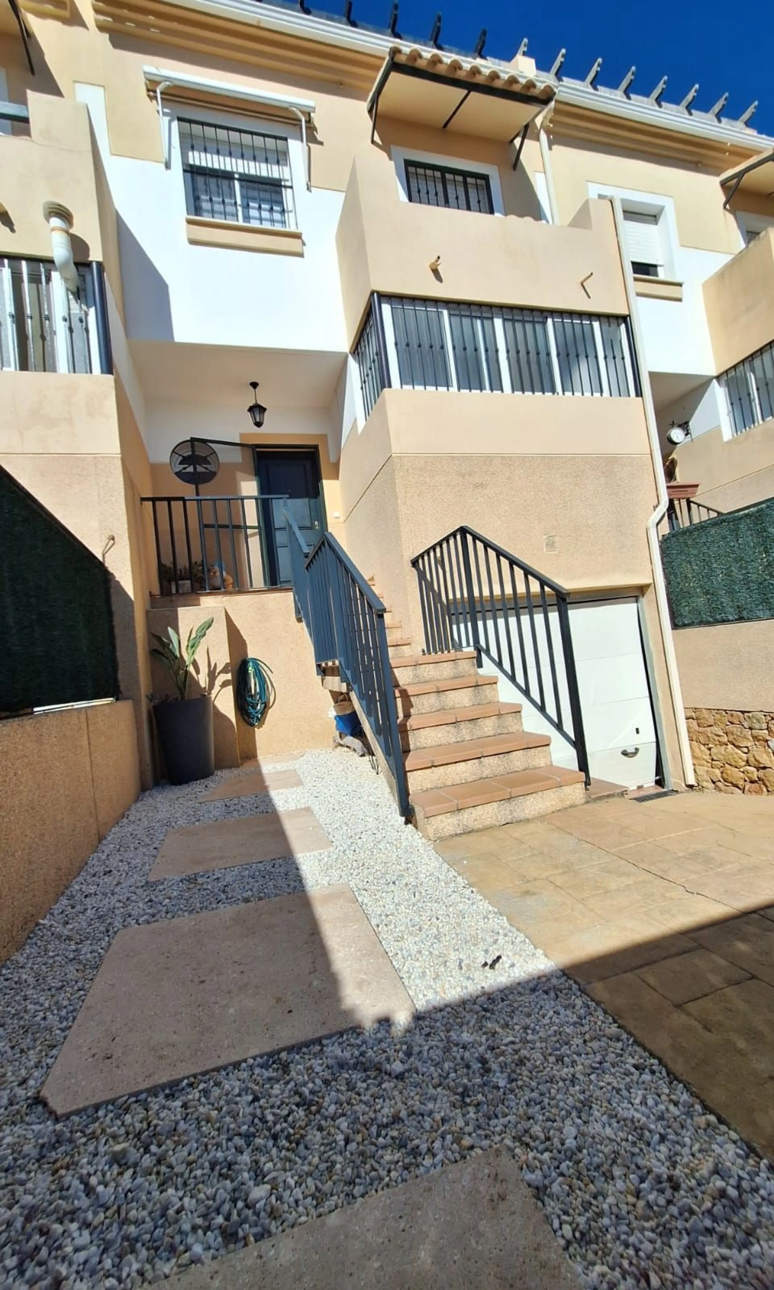 Discover unparalleled coastal serenity in this magnificent semi-detached townhouse within the prestigious Sierramar III urbanisation, a secure gated enclave in Marbella's exclusive Huerta del Prado-La Montúa district, nestled against the foothills of the 