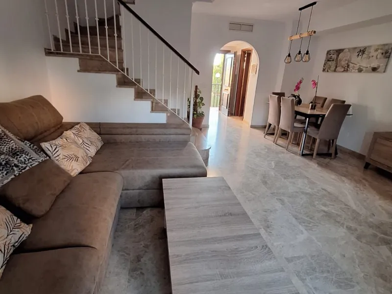 Discover unparalleled coastal serenity in this magnificent semi-detached townhouse within the prestigious Sierramar III urbanisation, a secure gated enclave in Marbella's exclusive Huerta del Prado-La Montúa district, nestled against the foothills of the 