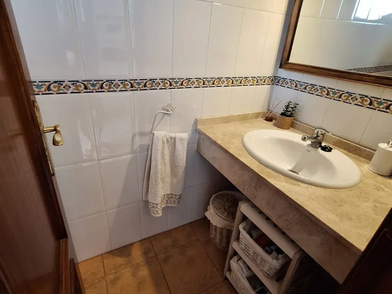 Discover unparalleled coastal serenity in this magnificent semi-detached townhouse within the prestigious Sierramar III urbanisation, a secure gated enclave in Marbella's exclusive Huerta del Prado-La Montúa district, nestled against the foothills of the 