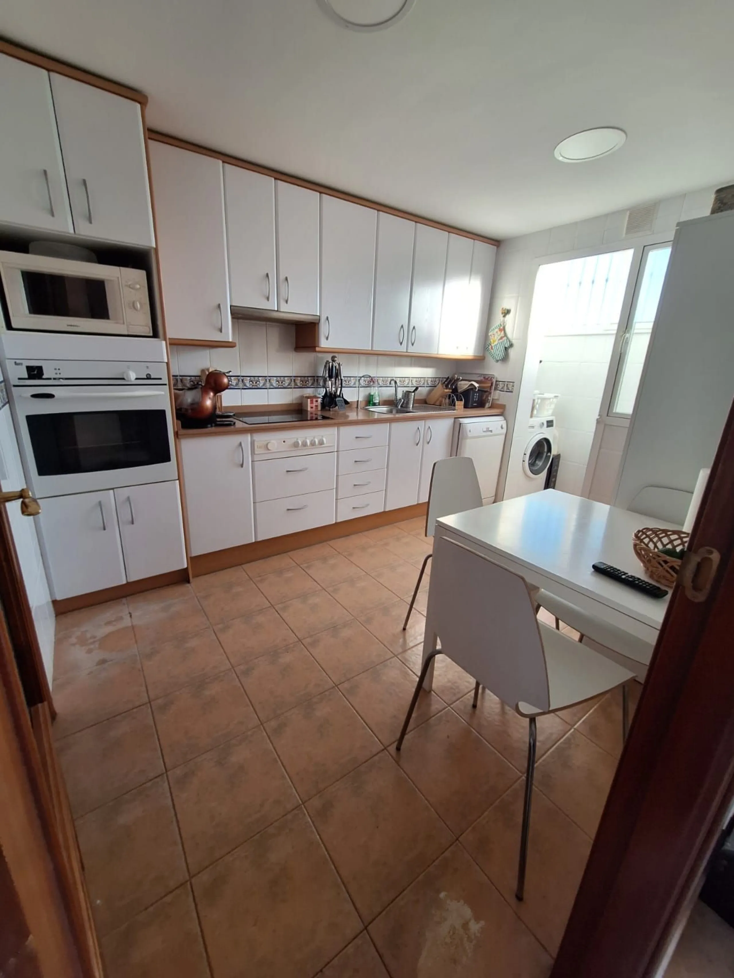Discover unparalleled coastal serenity in this magnificent semi-detached townhouse within the prestigious Sierramar III urbanisation, a secure gated enclave in Marbella's exclusive Huerta del Prado-La Montúa district, nestled against the foothills of the 