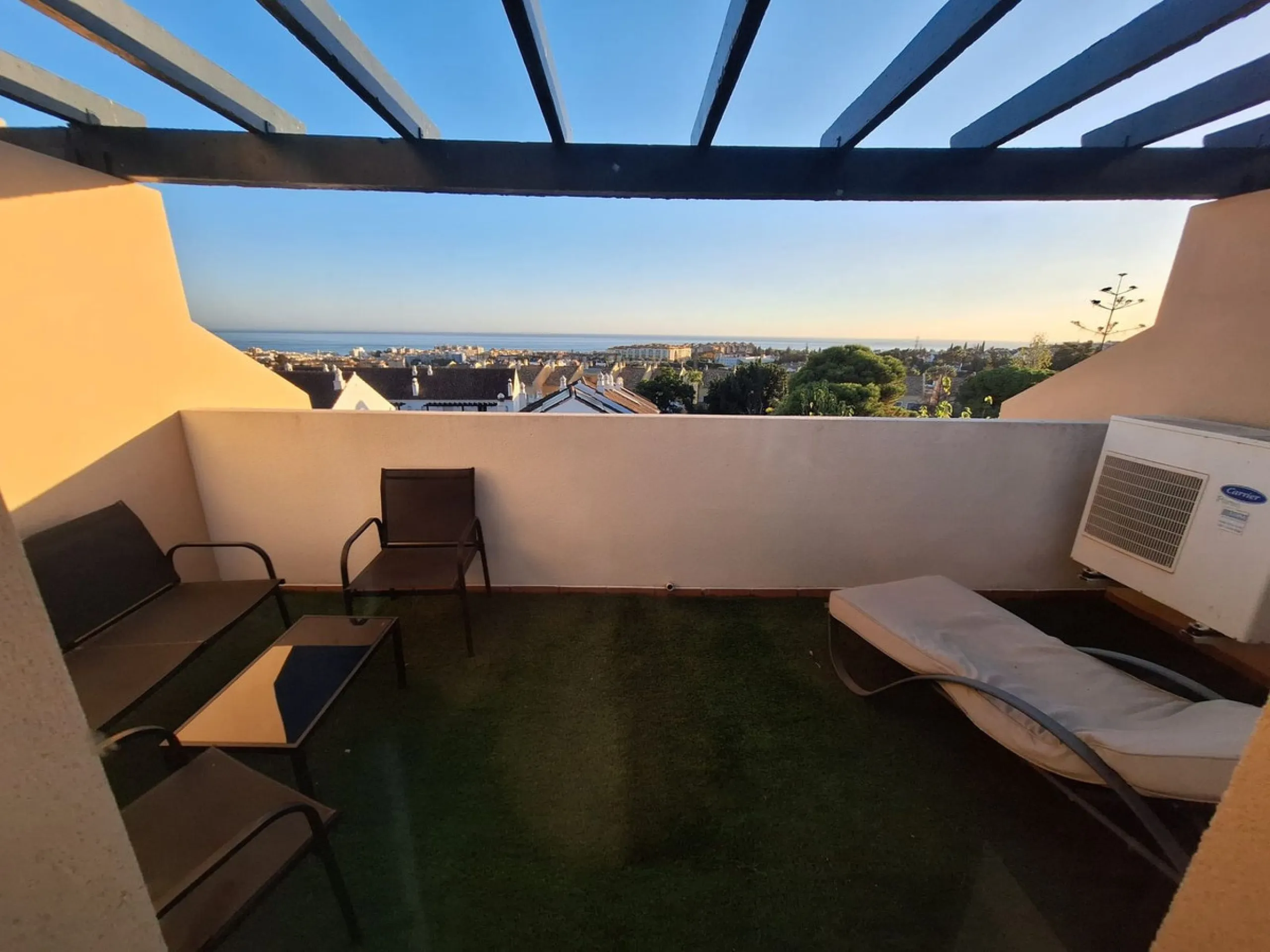 Discover unparalleled coastal serenity in this magnificent semi-detached townhouse within the prestigious Sierramar III urbanisation, a secure gated enclave in Marbella's exclusive Huerta del Prado-La Montúa district, nestled against the foothills of the 