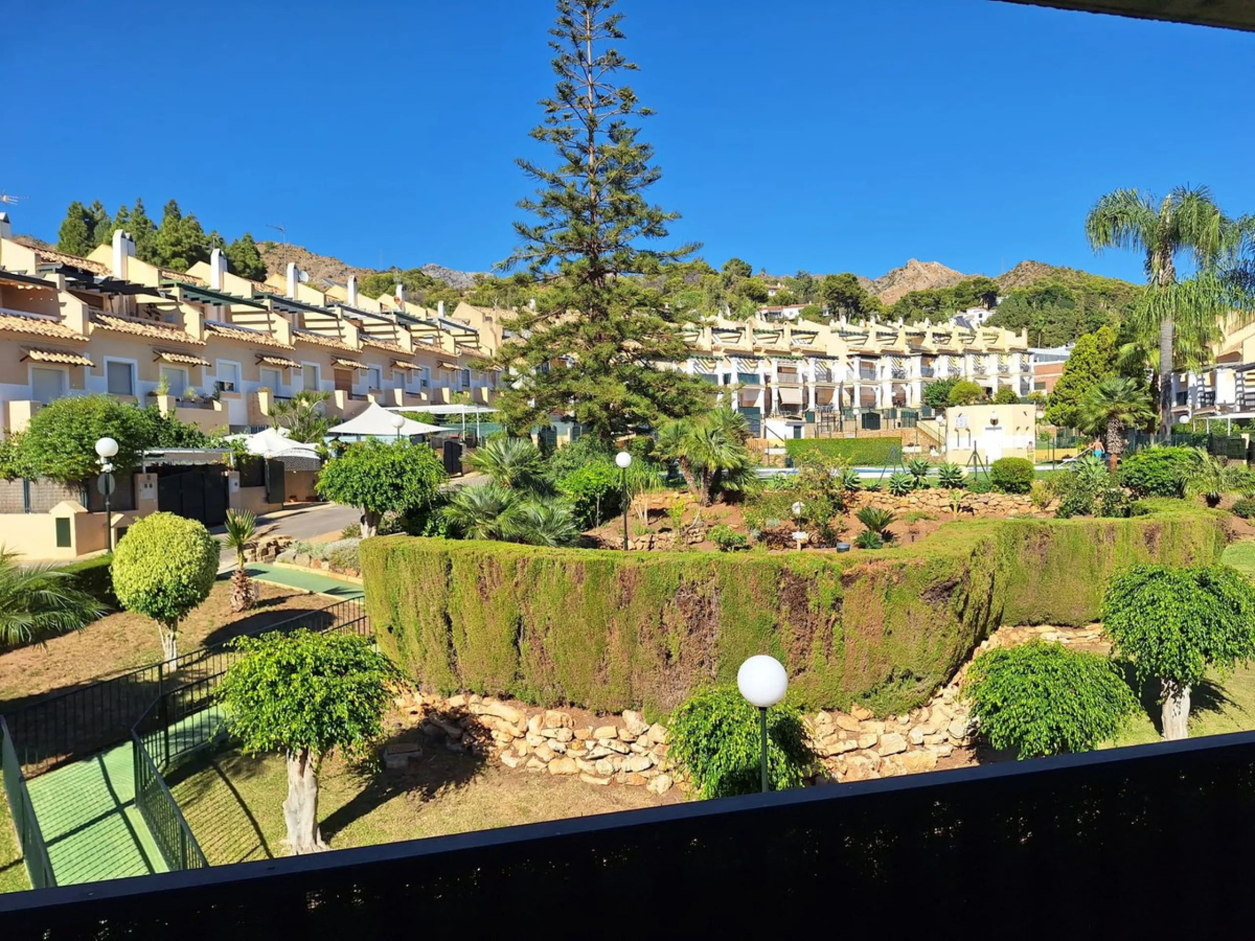 Discover unparalleled coastal serenity in this magnificent semi-detached townhouse within the prestigious Sierramar III urbanisation, a secure gated enclave in Marbella's exclusive Huerta del Prado-La Montúa district, nestled against the foothills of the 