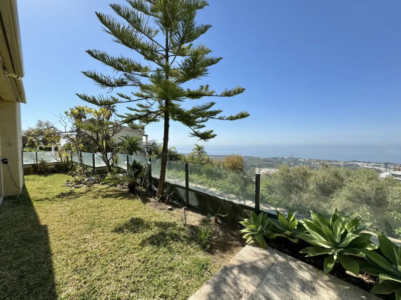 Nested in a natural and peaceful environment, surrounded by oak and pine trees, in an prestigious contemporary complex with 24 concierge and security service, this large 2 bedroom corner apartment offers some of the best views of the Mediterranean in Marb
