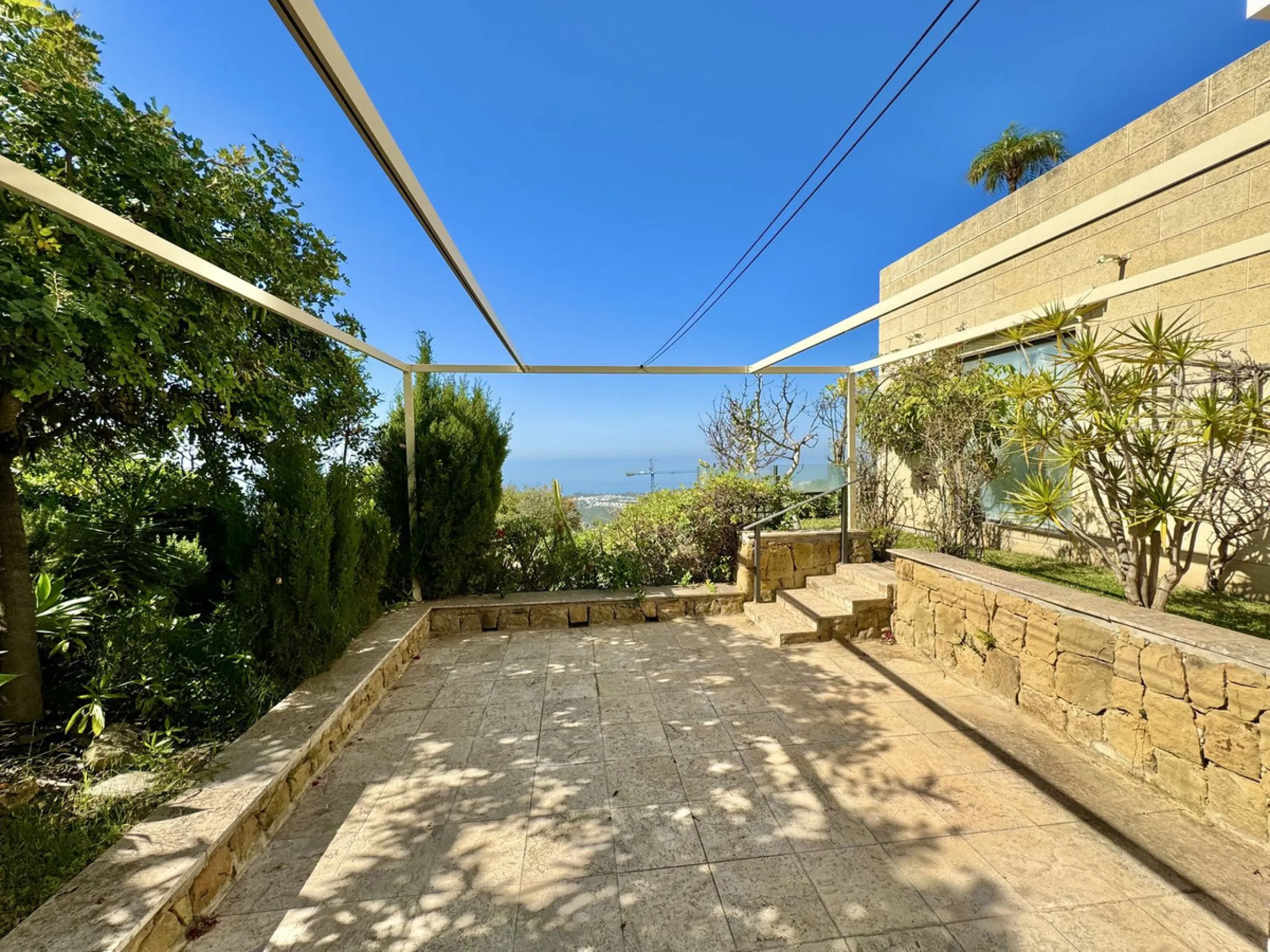 Nested in a natural and peaceful environment, surrounded by oak and pine trees, in an prestigious contemporary complex with 24 concierge and security service, this large 2 bedroom corner apartment offers some of the best views of the Mediterranean in Marb