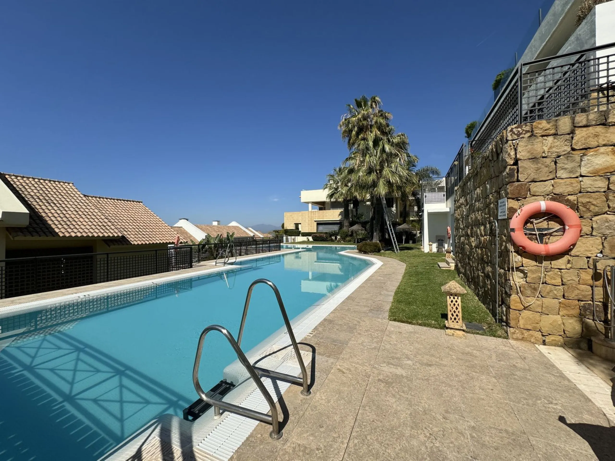 Nested in a natural and peaceful environment, surrounded by oak and pine trees, in an prestigious contemporary complex with 24 concierge and security service, this large 2 bedroom corner apartment offers some of the best views of the Mediterranean in Marb