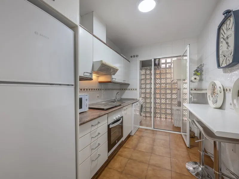 Two-bedroom, two-bathroom flat with a spacious living/dining room opening onto a large terrace. Kitchen plus utility room. One parking space included in the price.