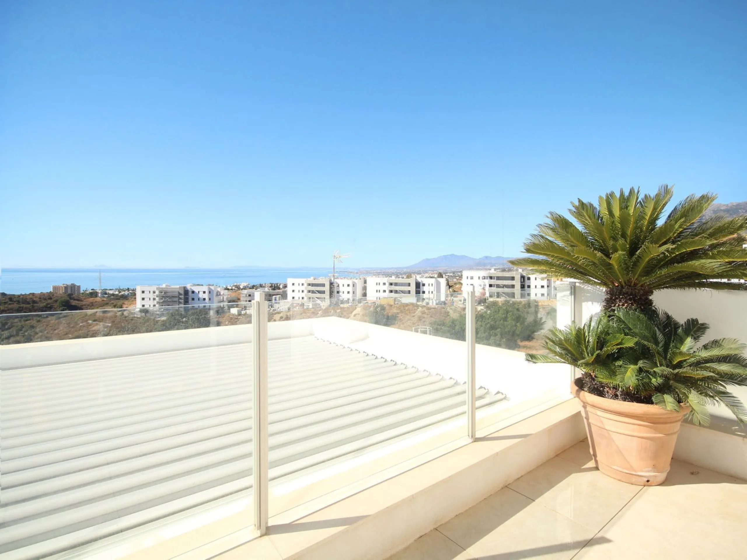 STUNNING Penthouse with panoramic, unobstructed views in the beautiful, newly built Elements gated complex in Altos de Marbella, just an 8-minute drive from alluring beaches and the Marbella arch. This glamorous southwest-oriented home boasts magnificent 