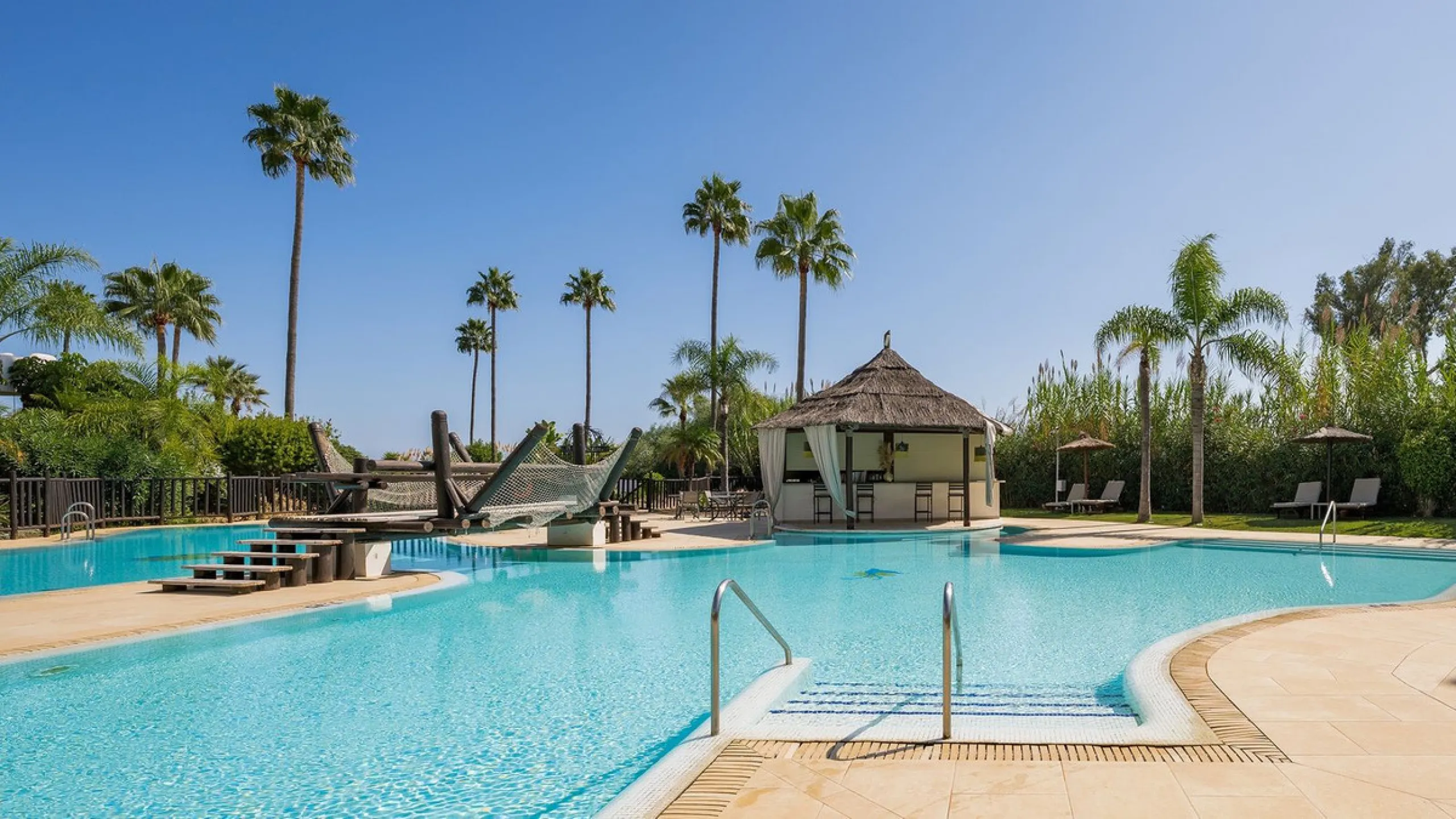 This exceptional ground-floor apartment combines luxury, comfort, and tranquility in perfect harmony. Featuring three spacious bedrooms and two bathrooms across 126 sqm of thoughtfully designed living space, the home offers an open-plan layout that unites