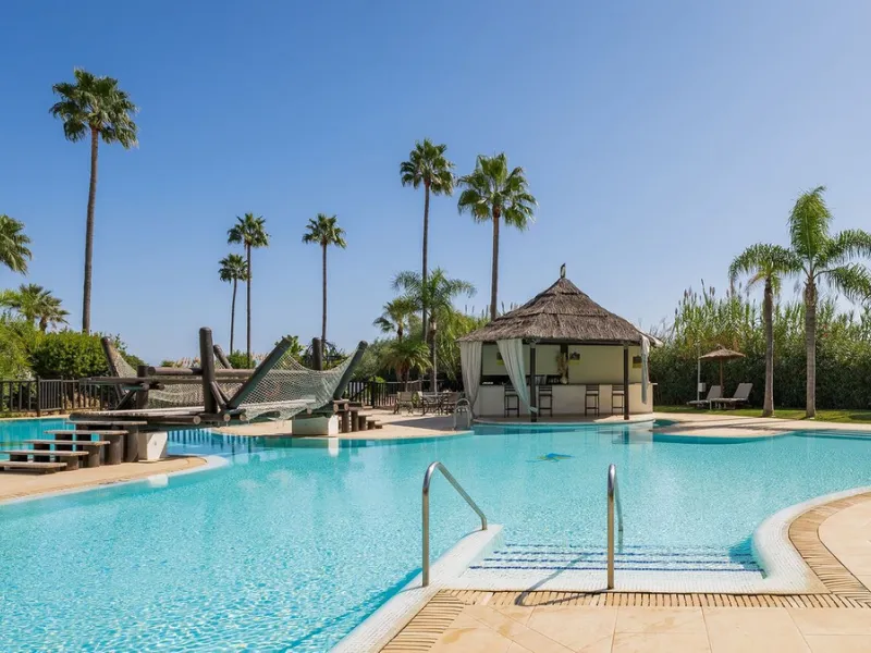 This exceptional ground-floor apartment combines luxury, comfort, and tranquility in perfect harmony. Featuring three spacious bedrooms and two bathrooms across 126 sqm of thoughtfully designed living space, the home offers an open-plan layout that unites