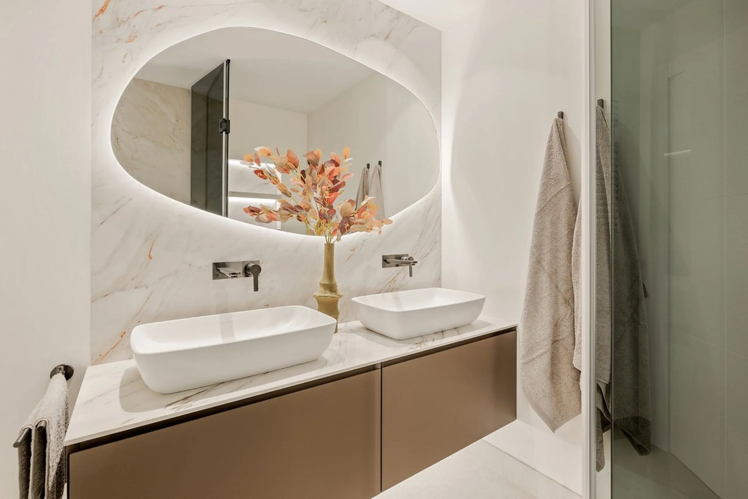 This exceptional ground-floor apartment combines luxury, comfort, and tranquility in perfect harmony. Featuring three spacious bedrooms and two bathrooms across 126 sqm of thoughtfully designed living space, the home offers an open-plan layout that unites