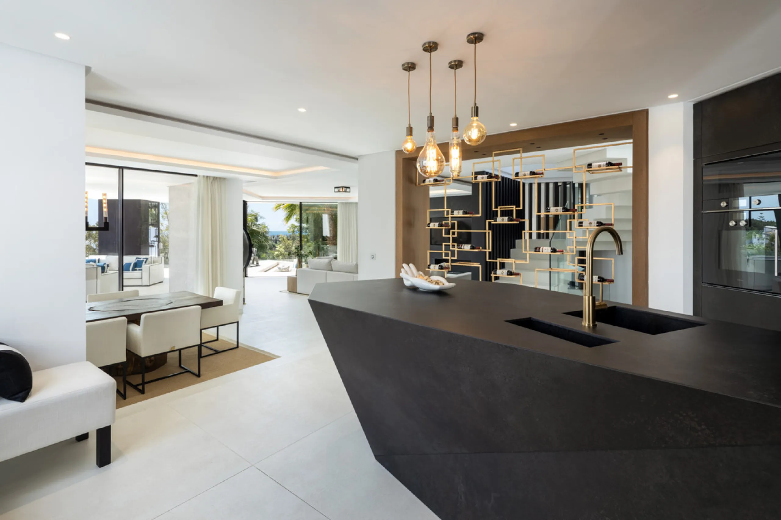 This is a contemporary 5-bedroom luxury villa for sale in the prestigious La Quinta Golf Resort, Benahavís, offering panoramic views and exceptional modern living in one of the Costa del Sol's most desirable gated communities.