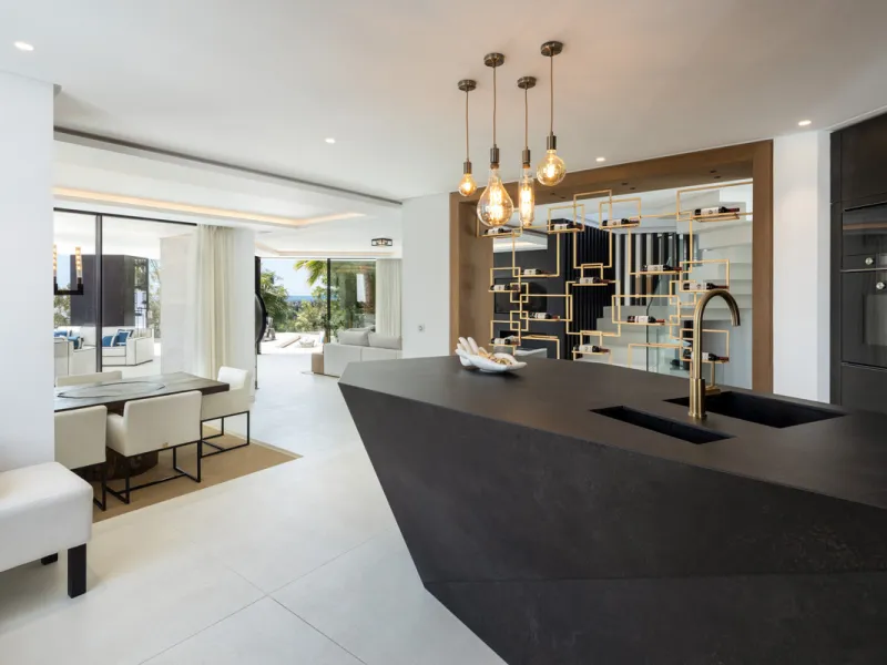 This is a contemporary 5-bedroom luxury villa for sale in the prestigious La Quinta Golf Resort, Benahavís, offering panoramic views and exceptional modern living in one of the Costa del Sol's most desirable gated communities.