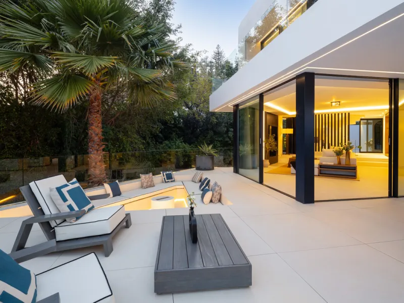 This is a contemporary 5-bedroom luxury villa for sale in the prestigious La Quinta Golf Resort, Benahavís, offering panoramic views and exceptional modern living in one of the Costa del Sol's most desirable gated communities.