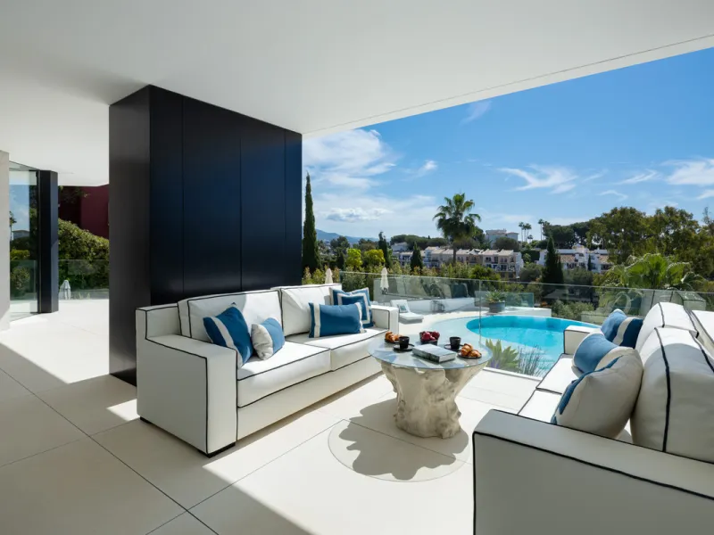 This is a contemporary 5-bedroom luxury villa for sale in the prestigious La Quinta Golf Resort, Benahavís, offering panoramic views and exceptional modern living in one of the Costa del Sol's most desirable gated communities.