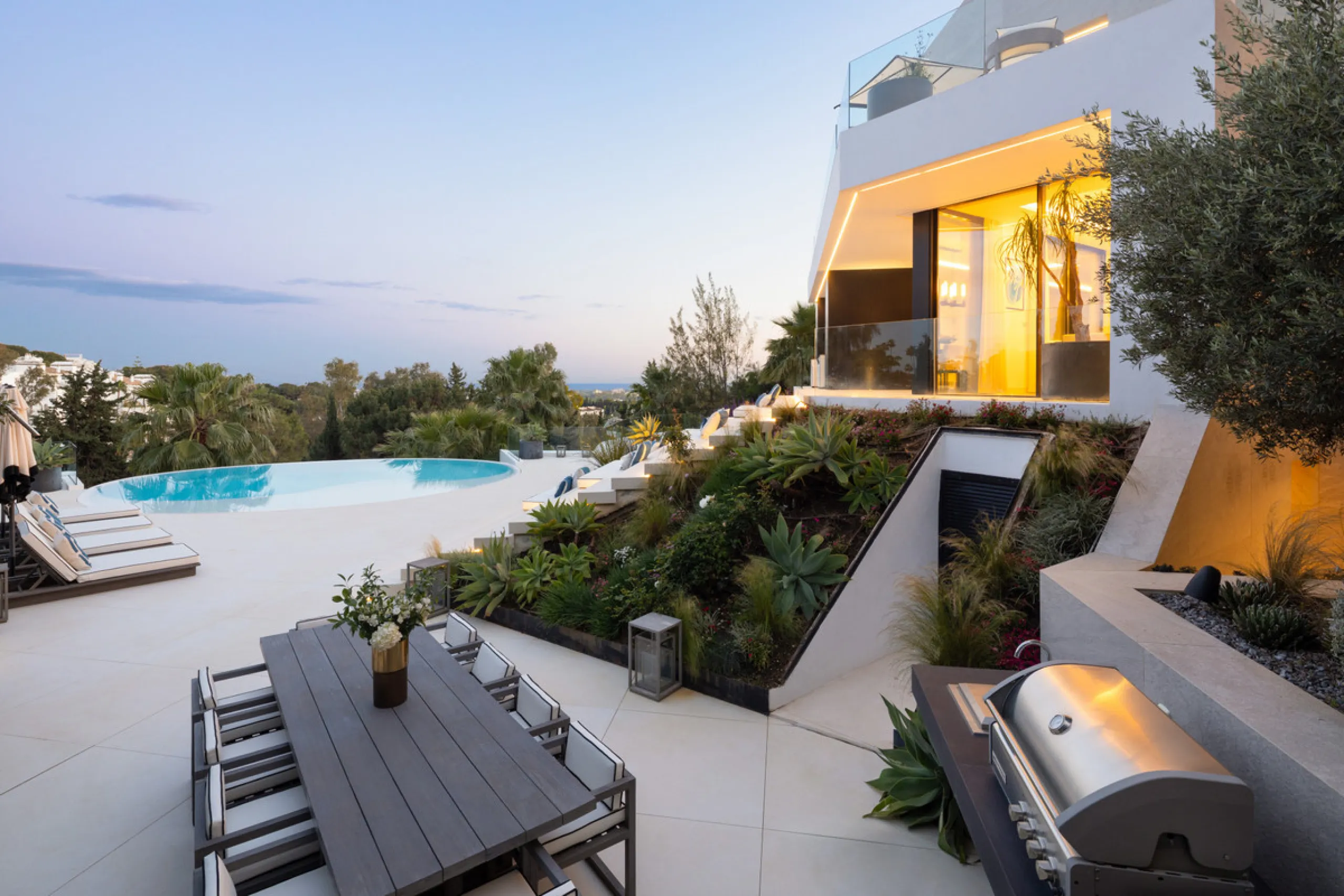 This is a contemporary 5-bedroom luxury villa for sale in the prestigious La Quinta Golf Resort, Benahavís, offering panoramic views and exceptional modern living in one of the Costa del Sol's most desirable gated communities.