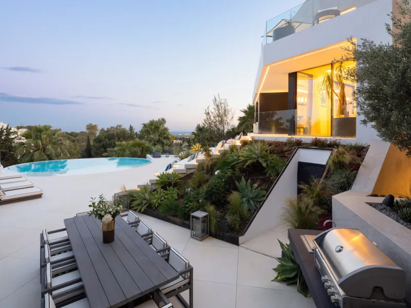 This is a contemporary 5-bedroom luxury villa for sale in the prestigious La Quinta Golf Resort, Benahavís, offering panoramic views and exceptional modern living in one of the Costa del Sol's most desirable gated communities.